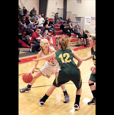 Arlee’s Lady Scarlet Carly Hergett scored nine points in the winning game against St. Regis last Thursday.   