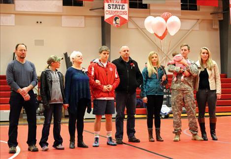 Alex Bertollt, standing with his family, is the lone senior honored at Friday’s Arlee Mixer.