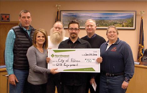 Celebrating the grant to support GIS mapping are, from left, Tim Lake of Lake Seed Inc; Joey Hennes, Relationship Manager/VP of Northwest Farm Credit Services of the Missoula branch; Tony Porrazzo, Polson Water and Sewer Superintendent; Forrest Niemeyer, Water and Sewer GIS Technician; Polson City Manager Mark Shrives; and Karen Sargeant, Polson parks director. 