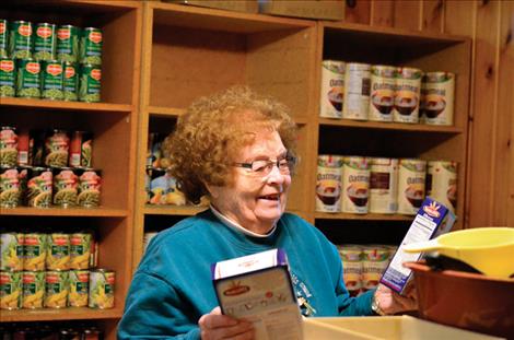 Sherri McDonald helps stock shelves.