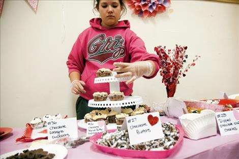 Sara Schall organizes cupcakes for taste testers.