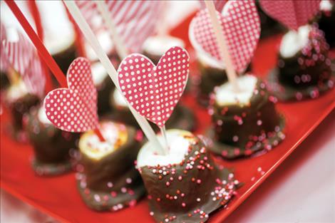 Chocolate creations of all kinds line the table at the 12th annual Chocolate Lovers’ Festival in Arlee.