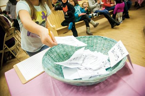 Festival goers cast their  ballots for their favorite chocolate confections.