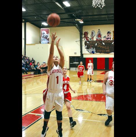 Casadi Wunderlich puts up a shot during a recent game against the Arlee Scarlets.