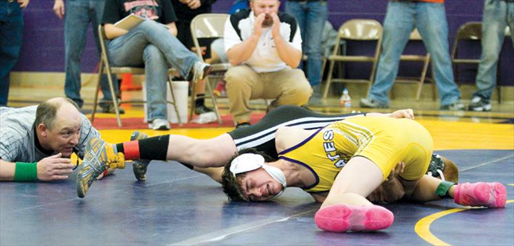 Polson’s Jaben Wenzel struggles to free himself from his opponent’s grip during the Polson Invitational wrestling tournament Saturday.