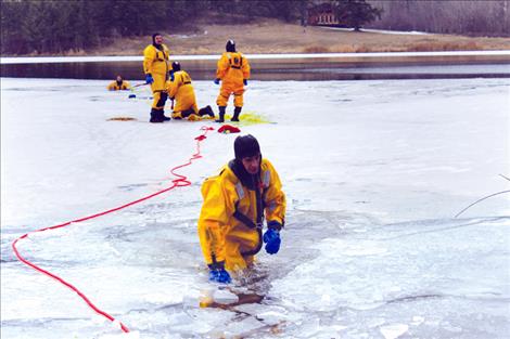 Kent Luetzen/ValleyJournal Ice on Jette Lake provided the right conditions to practice rescuing “victims.”