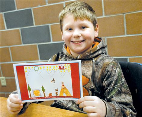 Polson fourth-grader Jackson Seifert displays his artwork on the front of the Confederated Salish and Kootenai Tribes’ Christmas card.  