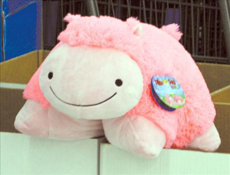 A plush pink pig sits atop the Toys for Tots donation boxes inside Polson’s Walmart. 
