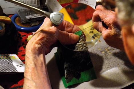 Doris Snyder uses the peyote stitch to create a beaded picture.