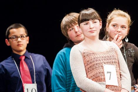 Shalom Walker and other spelling bee participants wait their turn to test their skills.