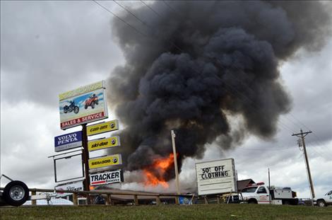 Flames move through S&S Sports on Monday afternoon. 