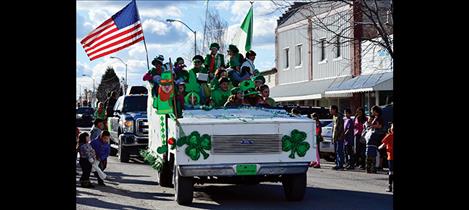 Folks wear green of all sorts for the St. Patrick’s Day parade.