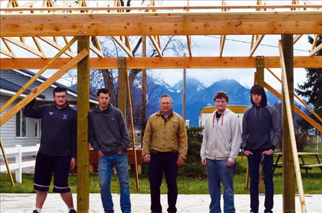 Christopher Hahn, Packer Pearson, Mr. Stan Atchley, Tristan Stevens, and Caleb Dotson take a break from building the pavilion.