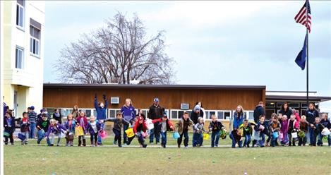 Children run at the sound of “Go” Thursday during Charlo Elementary Schools’ Easter egg hunt. 