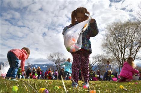 Eva Carnell, 6, stuffs an egg into her bag in Ronan.  