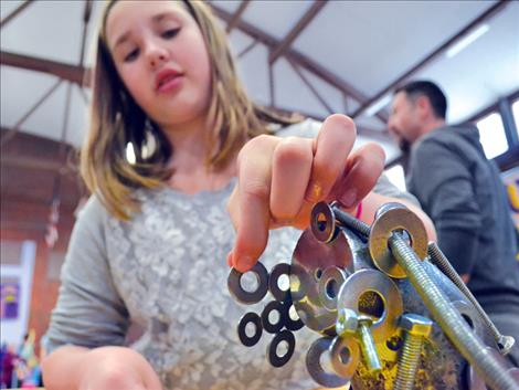 Finley Johnson, fifth grade, explores magnets during family science night at Linderman gym.