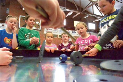 A spinning turntable, part of the University of Montana’s spectrUM program, sparks children’s interest.