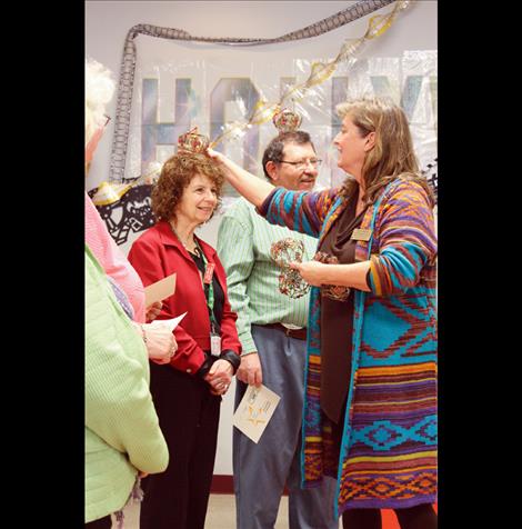 Retired senior volunteer Etta Moore is “crowned” during a recent event honoring RSVP volunteers.