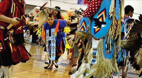 Jack Rodeghiero dances among the male powwow dancers.