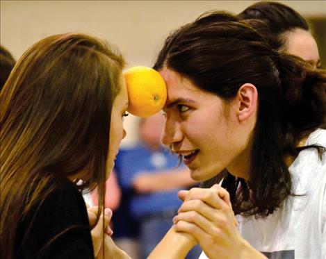 Sydney Castor and Nick Durglo compete together in the orange dance.