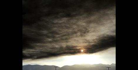 Black smoke from the Tire Depot in Pablo fire spreads across the valley.