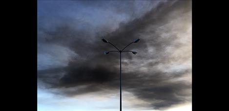 Black smoke from the Tire Depot fire spreads across the valley.