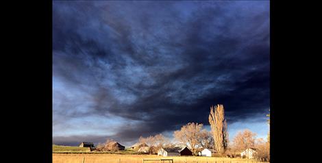 Black smoke from the Tire Depot fire spreads across the valley.