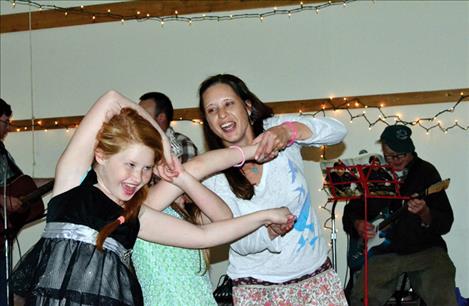 Grace Sween, 10, gets twisted up during a dance. 