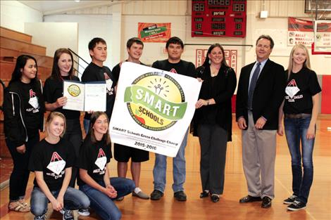 Students in the Arlee EAGLES club hold the $1,000 Green Challenge award given them by the State of Montana for being one of the winners of the SMART Schools Challenges.