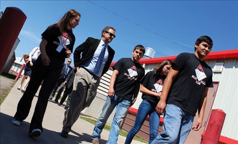 Students lead Governor Bullock on a tour through Arlee’s recycling facility.