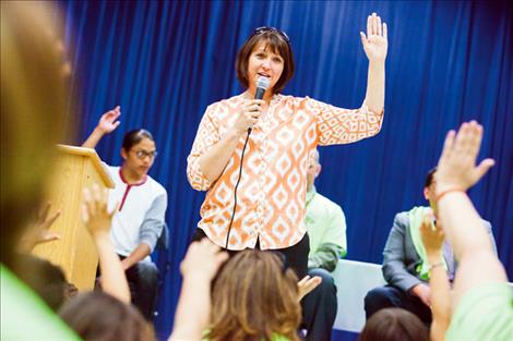Superintendent of Public Instruction Denise Juneau asks students to raise their hands if they plan to graduate from high school.