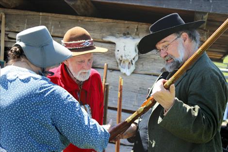 Will Abbot examines a weapon. 