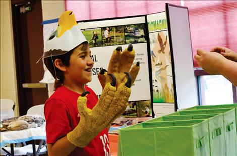 Connor Durglo, 8,  learns what  an eagle eats.