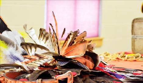 Native Americans use bird feathers to  decorate regalia.
