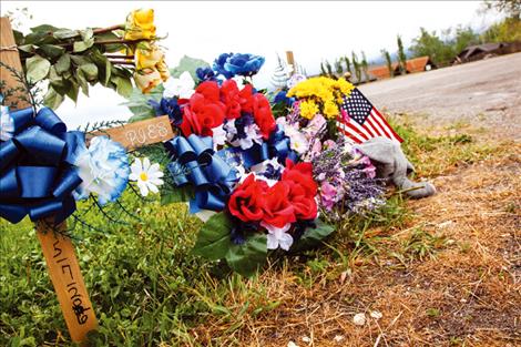 Friends and family leave items near the site where Bordeaux sold his homemade pies.