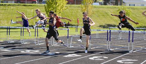 Polson’s Jacob Clairmont and Colton Cote race through the hurdles at an earlier meet.