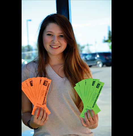 Ronan student Cori Normandeau holds raffle tickets.