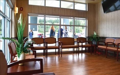 People gather outside the waiting room during Fresenius Medical Care open house May 12. The center expects to open later this month.