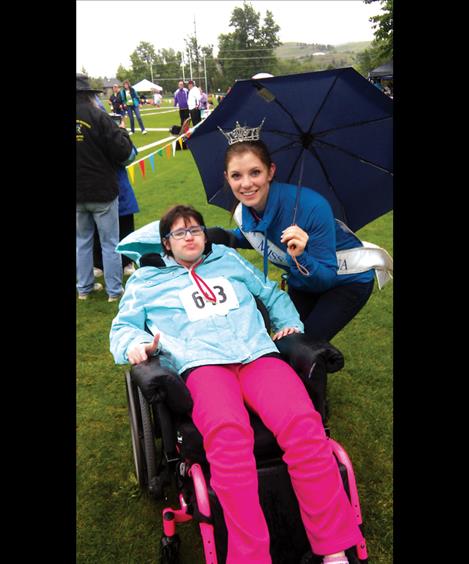 Miss Montana Danielle Wineman greets Ronan athlete Victoria Normandeu at the state games in Missoula.
