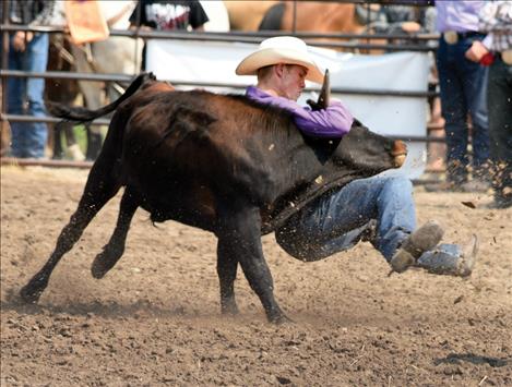 Will Powell competes in steer wrestling as a high school athlete.