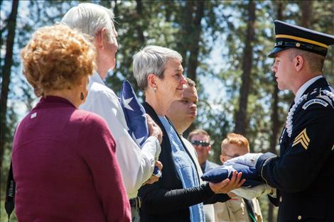 Tom Needham and his daughter, Kimberly Chenoweth, receive flags on behalf of a grateful nation, to honor Tom's brother SSGT Robert Needham. Robert's plane went down under enemy fire 72 years ago during WWII.