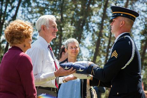 Tom Needham and his daughter, Kimberly Chenoweth, receive flags on behalf of a grateful nation, to honor Tom's brother SSGT Robert Needham. Robert's plane went down under enemy fire 72 years ago during WWII.