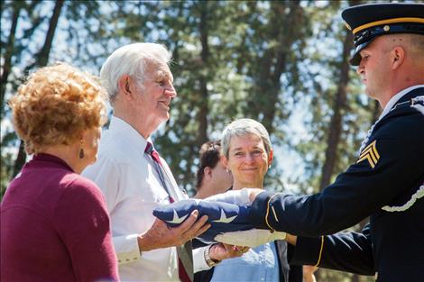 Tom Needham and his daughter, Kimberly Chenoweth, receive flags on behalf of a grateful nation, to honor Tom's brother SSGT Robert Needham. Robert's plane went down under enemy fire 72 years ago during WWII.