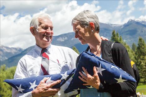 Tom Needham and his daughter, Kimberly Chenoweth, receive flags on behalf of a grateful nation, to honor Tom's brother SSGT Robert Needham. Robert's plane went down under enemy fire 72 years ago during WWII.