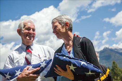 Tom Needham and his daughter, Kimberly Chenoweth, receive flags on behalf of a grateful nation, to honor Tom's brother SSGT Robert Needham. Robert's plane went down under enemy fire 72 years ago during WWII.