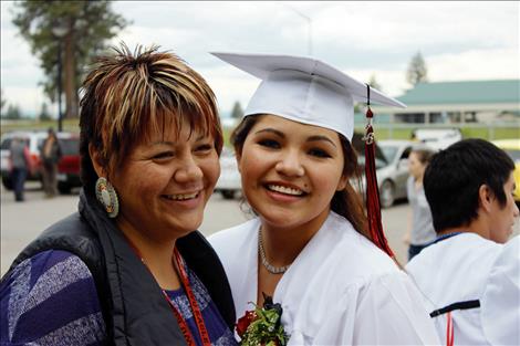 Graduate Lynsey Rae American Horse stands with Salish Kootenai College transistion coach Selena Kenmille.