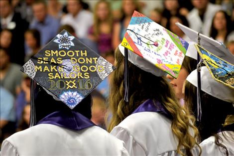 Uniquely-decorated mortarboards show graduates' personalities.