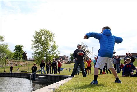 munity members gather at Riverside Park in Polson for the second annual Rock Skipping Championships.