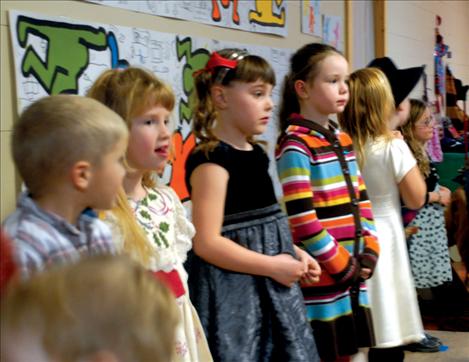 Valley View  students  Koy McAllister,  Alyssa Orien, Adeline Warneke, Ryleigh Bell and Hailey Hanson wait for the Christmas program to begin.