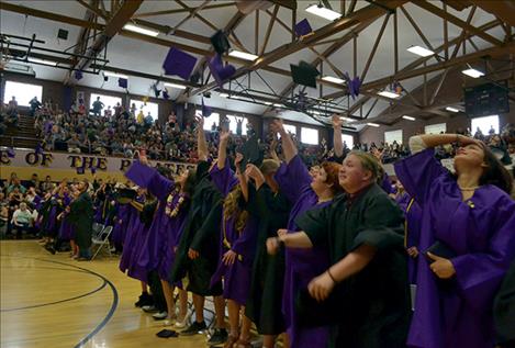 Caps fly as the Polson Class of 2016 celebrates at Saturday’s commencement ceremony.